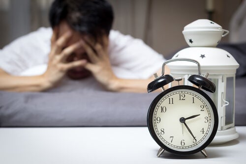 A worried man in need of pharmacological treatment for insomnia.