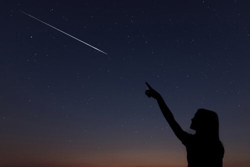 A woman seeing a shooting star.