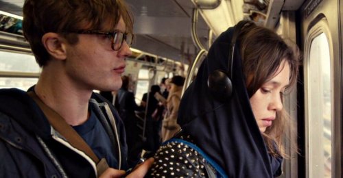A man and a woman on a train.