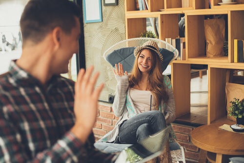 A woman greeting people.