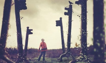 A man walking among giant keys.