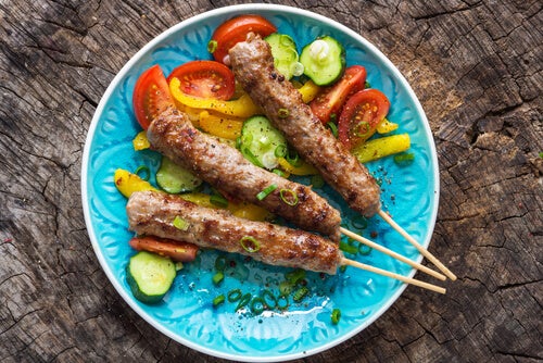 A plate of meat kabobs.