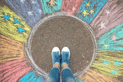 A person standing in a circle representing their comfort zone or familiar zone.