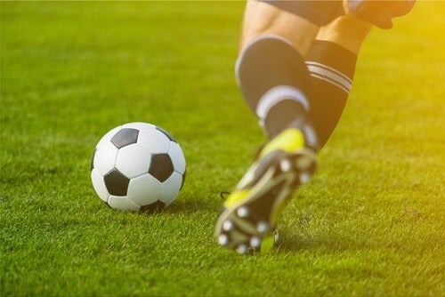 This player kicking the ball can benefit from knowing about the psychology of soccer.
