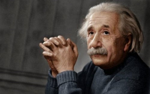 Albert Einstein listening intently.