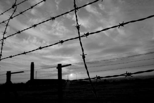 A barbed wire fence at a concentration camp.