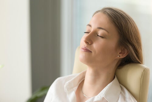 A woman meditating.