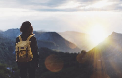 A backpacker on top of a mountain.
