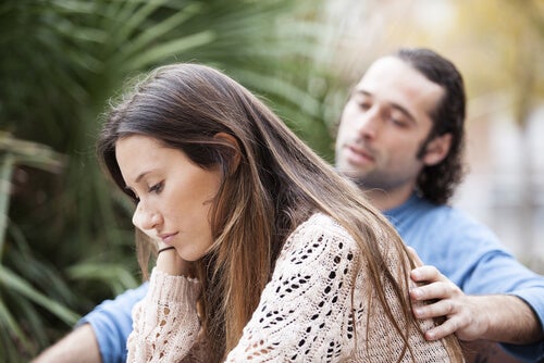 A man comforting a woman.