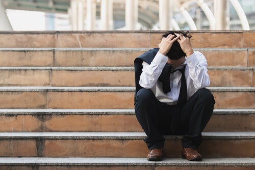 A man pondering about his health and unemployment.