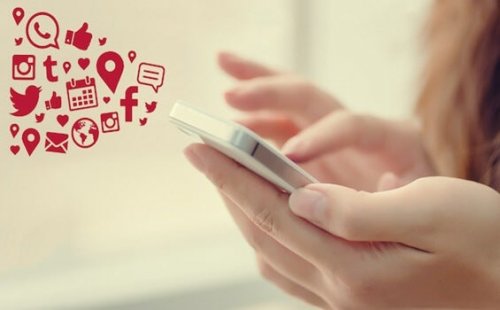 A person typing on a phone.