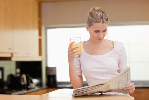 A woman reading the morning news.