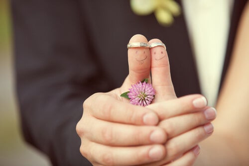 Two people wearing rings on their thumbs.