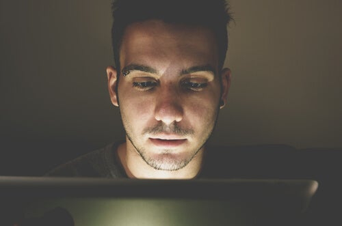 A man using his computer.
