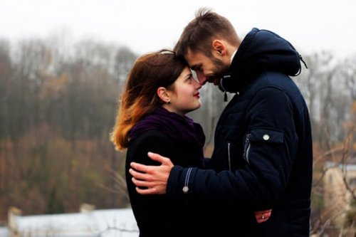 Two people looking at each other in the eyes.