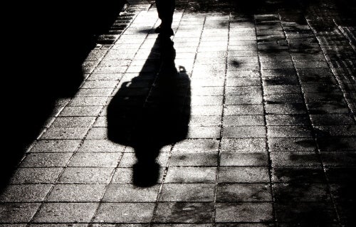 A man's shadow on the ground.