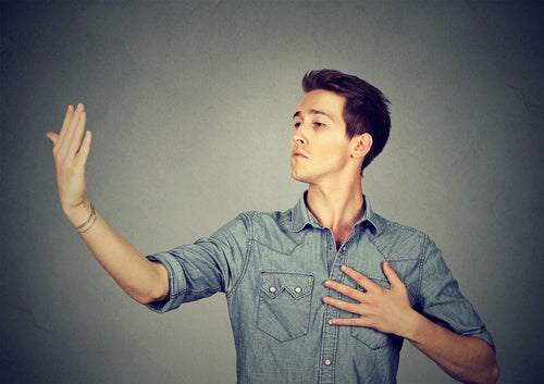 A man making narcissistic gestures.