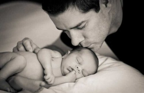 A newborn baby and father.