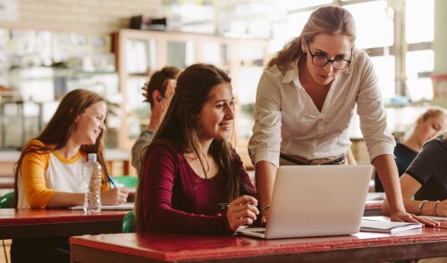 A woman teaching a female student.