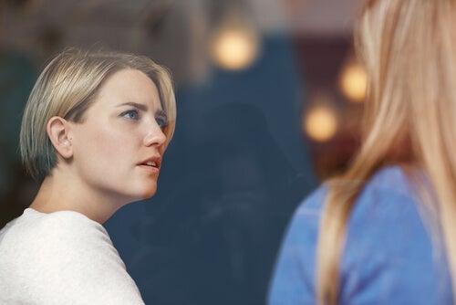 Two women practicing assertive techniques.