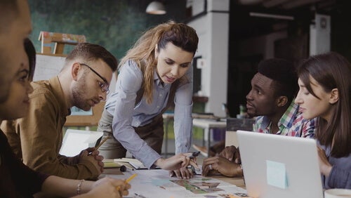 A woman leading a work meeting.