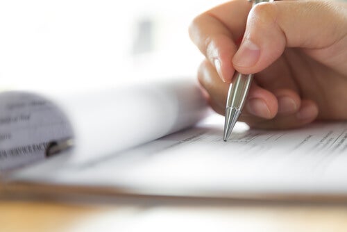 A person writing.