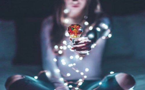 A woman lighting herself.