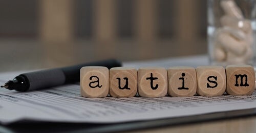 Blocks on paper spelling out the word "autism".