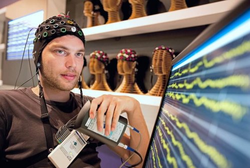 A man neurogaming in a room.