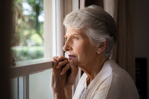 A woman looking out of a window.