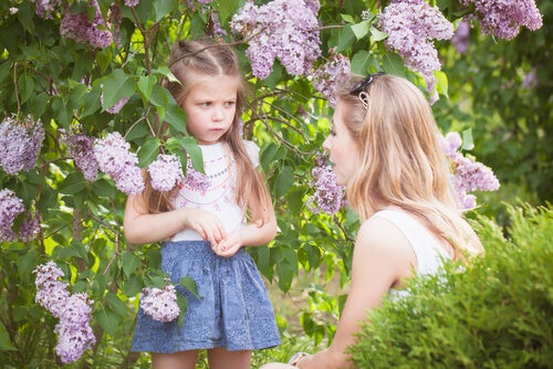 A girl listening to a woman.