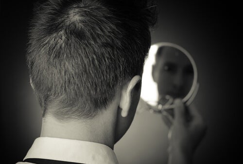 A person looking in the mirror.