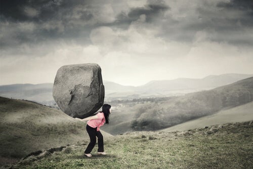 A woman carrying a big rock.
