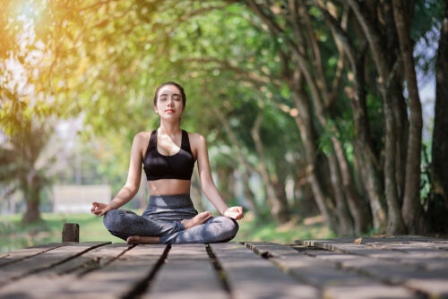 A woman meditating.
