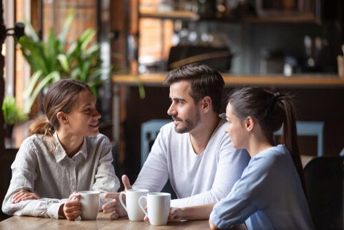 Three people at a coffee shop.