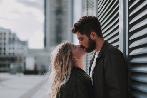 Two people kissing.