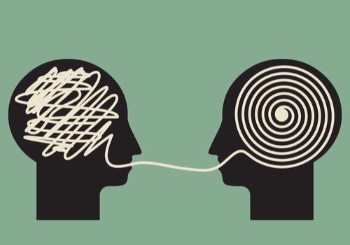 A cartoon of two human brains commmunicating.