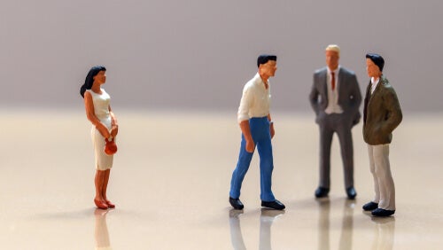 A scene of people talking made with small dolls.