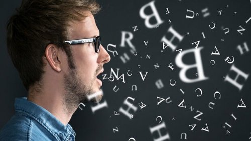 Letters coming out of a man's mouth.