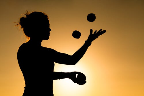 A woman juggling.