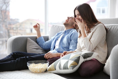 A couple watching a film.