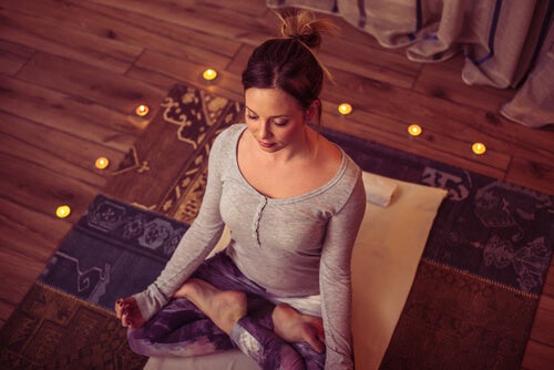 A woman meditating.