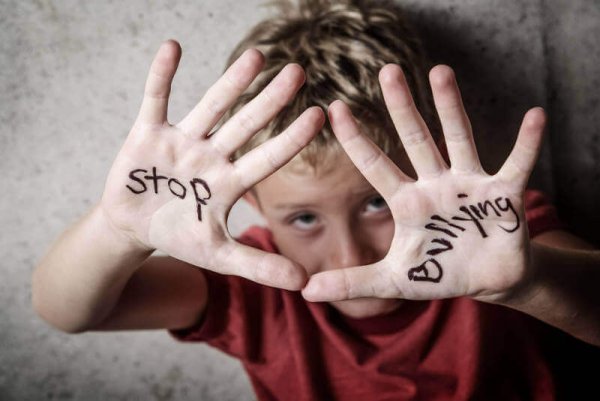 A boy with a stop bullying message.