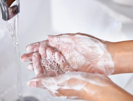 Someone washing their hands.