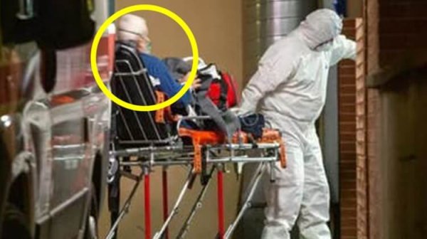 Alberto Belucci going to hospital.