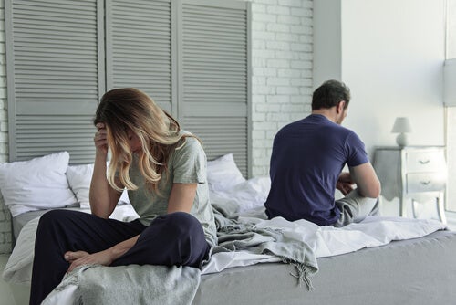 A couple not speaking to each other.