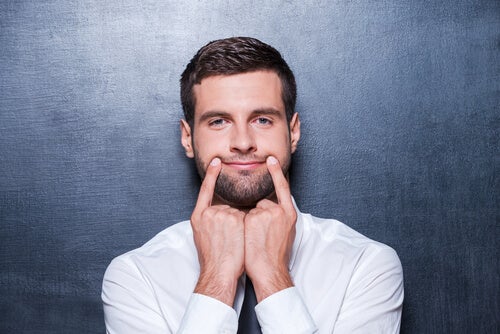 A man forcing a smile.