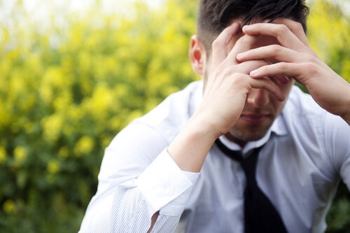 A man with a headache.