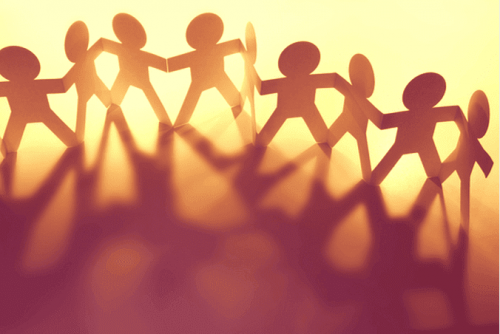 Shinny happy people holding hands.