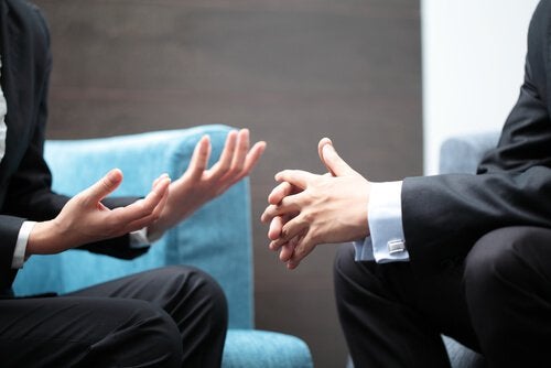 Two people talking.